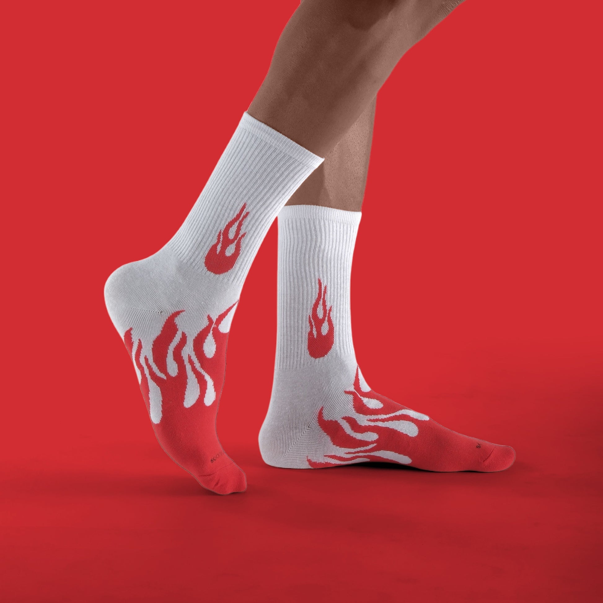 White socks with flame design on red background
